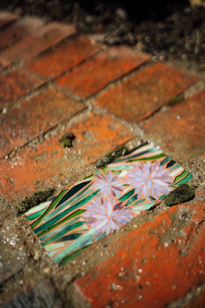 Garden mosaic made from stained glass scraps.