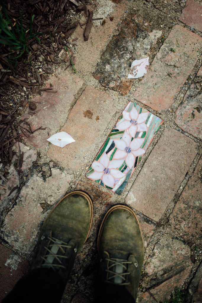 Garden brick mosaic made from stained glass scraps